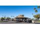 Golf clubhouse with numerous parked carts at 10103 W Forrester Dr, Sun City, AZ 85351