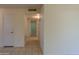 Bright hallway with tile floors and access to bedrooms at 10103 W Forrester Dr, Sun City, AZ 85351