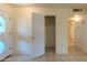 Bright hallway with tile floors and coat closet at 10103 W Forrester Dr, Sun City, AZ 85351