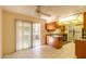 Bright kitchen with wood cabinets, stainless steel appliances, and tile floor at 10103 W Forrester Dr, Sun City, AZ 85351