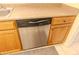 Stainless steel dishwasher installed in kitchen with wood cabinets at 10103 W Forrester Dr, Sun City, AZ 85351