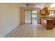 Bright kitchen with wood cabinets, stainless steel appliances, and tile floor at 10103 W Forrester Dr, Sun City, AZ 85351