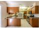 Bright kitchen with wood cabinets and stainless steel appliances at 10103 W Forrester Dr, Sun City, AZ 85351