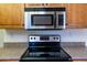 Stainless steel range and microwave in kitchen at 10103 W Forrester Dr, Sun City, AZ 85351