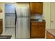 Kitchen with stainless steel refrigerator and laundry at 10103 W Forrester Dr, Sun City, AZ 85351