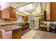 Bright kitchen with wood cabinets and stainless steel appliances at 10103 W Forrester Dr, Sun City, AZ 85351