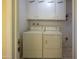 Laundry room with washer, dryer, and cabinets at 10103 W Forrester Dr, Sun City, AZ 85351