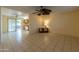 Bright living room with tile floors and ceiling fan at 10103 W Forrester Dr, Sun City, AZ 85351