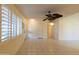 Bright living room with tile floors and ceiling fan at 10103 W Forrester Dr, Sun City, AZ 85351