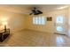 Bright living room with tile floors and ceiling fan at 10103 W Forrester Dr, Sun City, AZ 85351