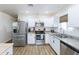 Modern kitchen with stainless steel appliances and granite countertops at 1546 W Pierce St, Phoenix, AZ 85007