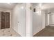 Bright hallway with tiled floor and wood door at 1622 E Hope St, Mesa, AZ 85203