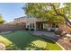 Large backyard with putting green and patio at 1864 W Buckhorn Trl, Phoenix, AZ 85085