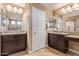 Double vanity bathroom with granite countertops and ample storage at 1864 W Buckhorn Trl, Phoenix, AZ 85085