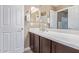 Bathroom with double vanity and dark wood cabinets at 1864 W Buckhorn Trl, Phoenix, AZ 85085