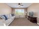 Cozy bedroom with a large sectional sofa and TV at 1864 W Buckhorn Trl, Phoenix, AZ 85085