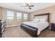 Main bedroom with plush bed and plenty of natural light at 1864 W Buckhorn Trl, Phoenix, AZ 85085