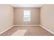 Well-lit bedroom with neutral walls and carpet flooring at 1864 W Buckhorn Trl, Phoenix, AZ 85085
