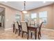 Bright dining room with a large table and chairs at 1864 W Buckhorn Trl, Phoenix, AZ 85085