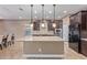 Modern kitchen with granite countertops and dark cabinets at 1864 W Buckhorn Trl, Phoenix, AZ 85085