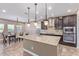 Spacious kitchen with island, granite counters, and dark wood cabinets at 1864 W Buckhorn Trl, Phoenix, AZ 85085