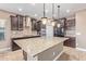 Modern kitchen with granite island and stainless steel appliances at 1864 W Buckhorn Trl, Phoenix, AZ 85085