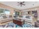 Open living room with view into the kitchen at 1864 W Buckhorn Trl, Phoenix, AZ 85085