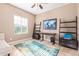 Bright home office featuring a large window and built-in shelving at 1864 W Buckhorn Trl, Phoenix, AZ 85085