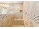 Spacious shower with tiled walls and built-in seat at 1864 W Buckhorn Trl, Phoenix, AZ 85085