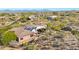 Aerial view of house with solar panels and mountain views at 24686 N 120Th Pl, Scottsdale, AZ 85255