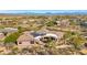 Aerial view of house with solar panels and desert landscape at 24686 N 120Th Pl, Scottsdale, AZ 85255