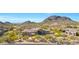Aerial view of house with mountain backdrop at 24686 N 120Th Pl, Scottsdale, AZ 85255