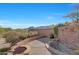 Landscaped backyard with firepit and mountain views at 24686 N 120Th Pl, Scottsdale, AZ 85255