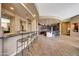 Wet bar with granite countertop and seating for three at 24686 N 120Th Pl, Scottsdale, AZ 85255