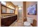 Bathroom with double sinks, granite countertop and walk-in shower at 24686 N 120Th Pl, Scottsdale, AZ 85255
