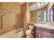 Clean bathroom with tub shower combo, tiled walls, and modern vanity at 24686 N 120Th Pl, Scottsdale, AZ 85255