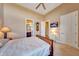 Bright bedroom with ensuite bathroom access, ceiling fan, and ample closet space at 24686 N 120Th Pl, Scottsdale, AZ 85255