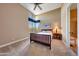 Bedroom with a full-size bed, nightstand and large window at 24686 N 120Th Pl, Scottsdale, AZ 85255