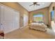 Bedroom with a queen bed, double door closet and a view at 24686 N 120Th Pl, Scottsdale, AZ 85255