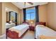 Spacious bedroom with two twin beds and a mirrored closet at 24686 N 120Th Pl, Scottsdale, AZ 85255