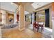Elegant dining room with chandelier and views of the desert landscape at 24686 N 120Th Pl, Scottsdale, AZ 85255