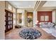 Elegant entryway with high ceilings, a large door, and a circular rug at 24686 N 120Th Pl, Scottsdale, AZ 85255