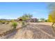 This beautiful home features a large driveway, desert landscaping, and mountain views at 24686 N 120Th Pl, Scottsdale, AZ 85255