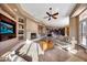 Spacious Gathering room with fireplace and built-in entertainment center at 24686 N 120Th Pl, Scottsdale, AZ 85255