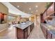Open concept kitchen with granite island, breakfast nook, and Gathering room views at 24686 N 120Th Pl, Scottsdale, AZ 85255