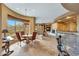 Open concept kitchen with an island, breakfast nook, and views into the living room at 24686 N 120Th Pl, Scottsdale, AZ 85255