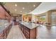 Gourmet kitchen boasts granite countertops, custom cabinetry, and island at 24686 N 120Th Pl, Scottsdale, AZ 85255