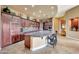 Modern kitchen with ample cabinetry, granite countertops, and stainless steel appliances at 24686 N 120Th Pl, Scottsdale, AZ 85255