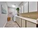 Laundry room with washer, dryer, and ample cabinets at 24686 N 120Th Pl, Scottsdale, AZ 85255