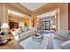 Spacious living room with comfortable seating and views to the entry and dining room at 24686 N 120Th Pl, Scottsdale, AZ 85255
